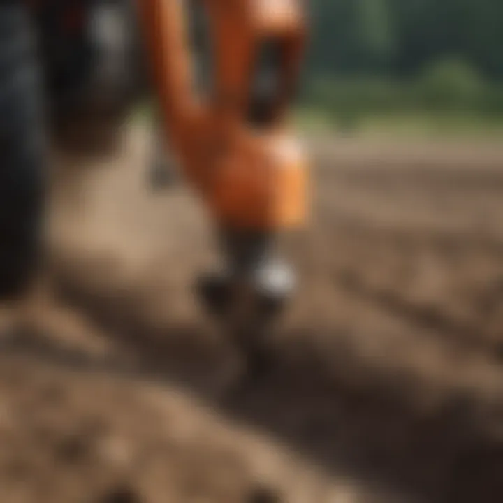 Close-up of a post hole auger cutting into the soil