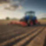 Tractor equipped with a post hole auger in a field