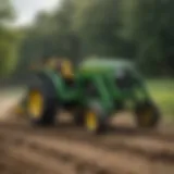 John Deere sub compact tractor in action with backhoe attachment