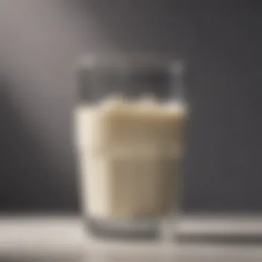 Detailed view of a glass of whole milk showcasing its creamy texture