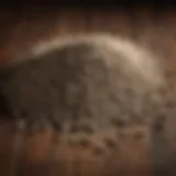 Close-up of rat bait pellets on a wooden surface