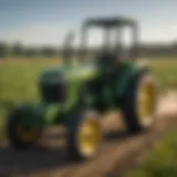 A robust John Deere utility tractor in a field