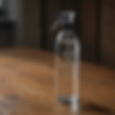 Water-Based Fly Spray Bottle A clear bottle of water-based fly spray for horses on a wooden surface